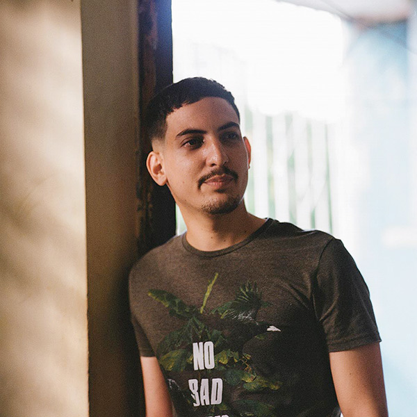 a young man standing in a doorway